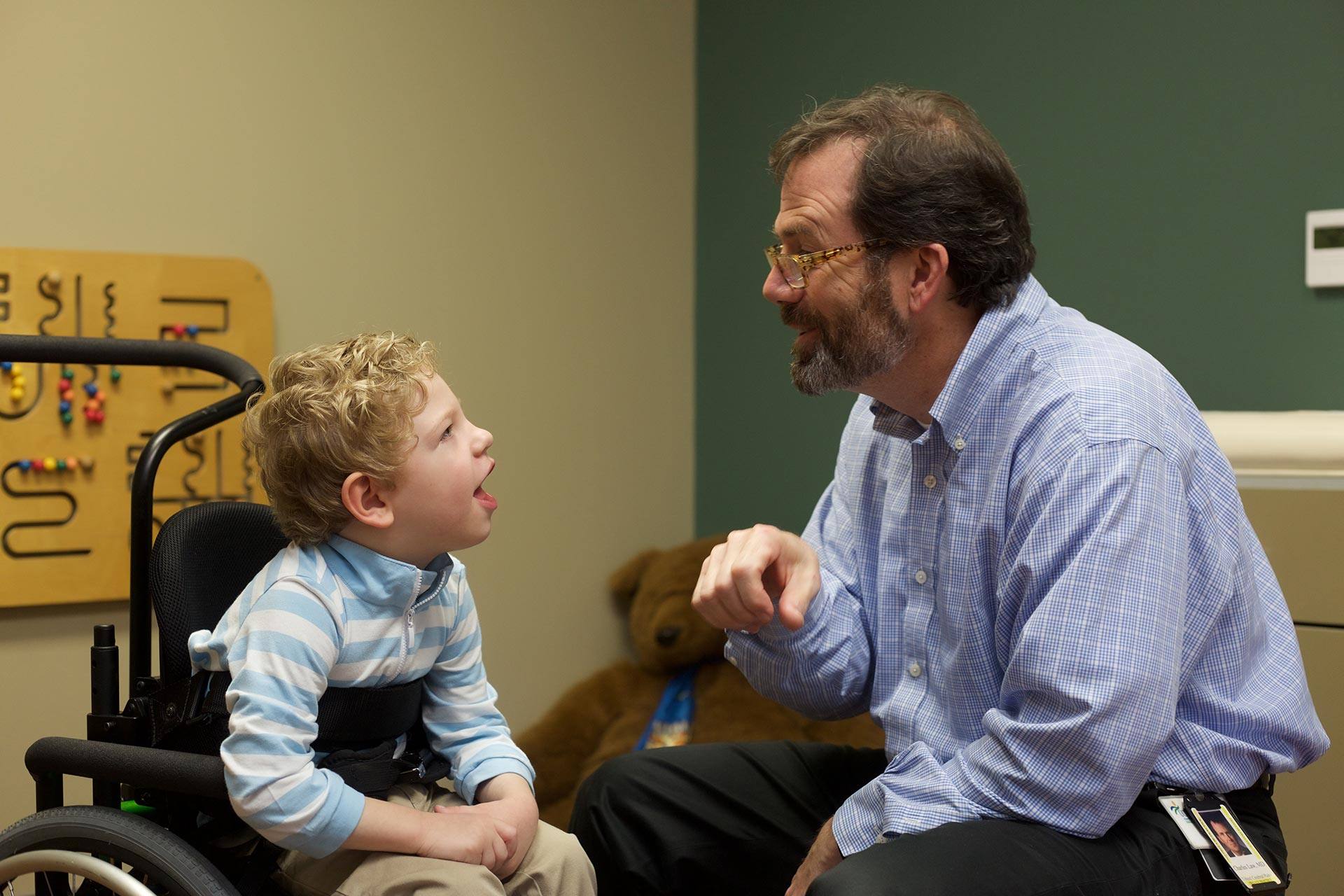 United Ability doctor talking to young patient