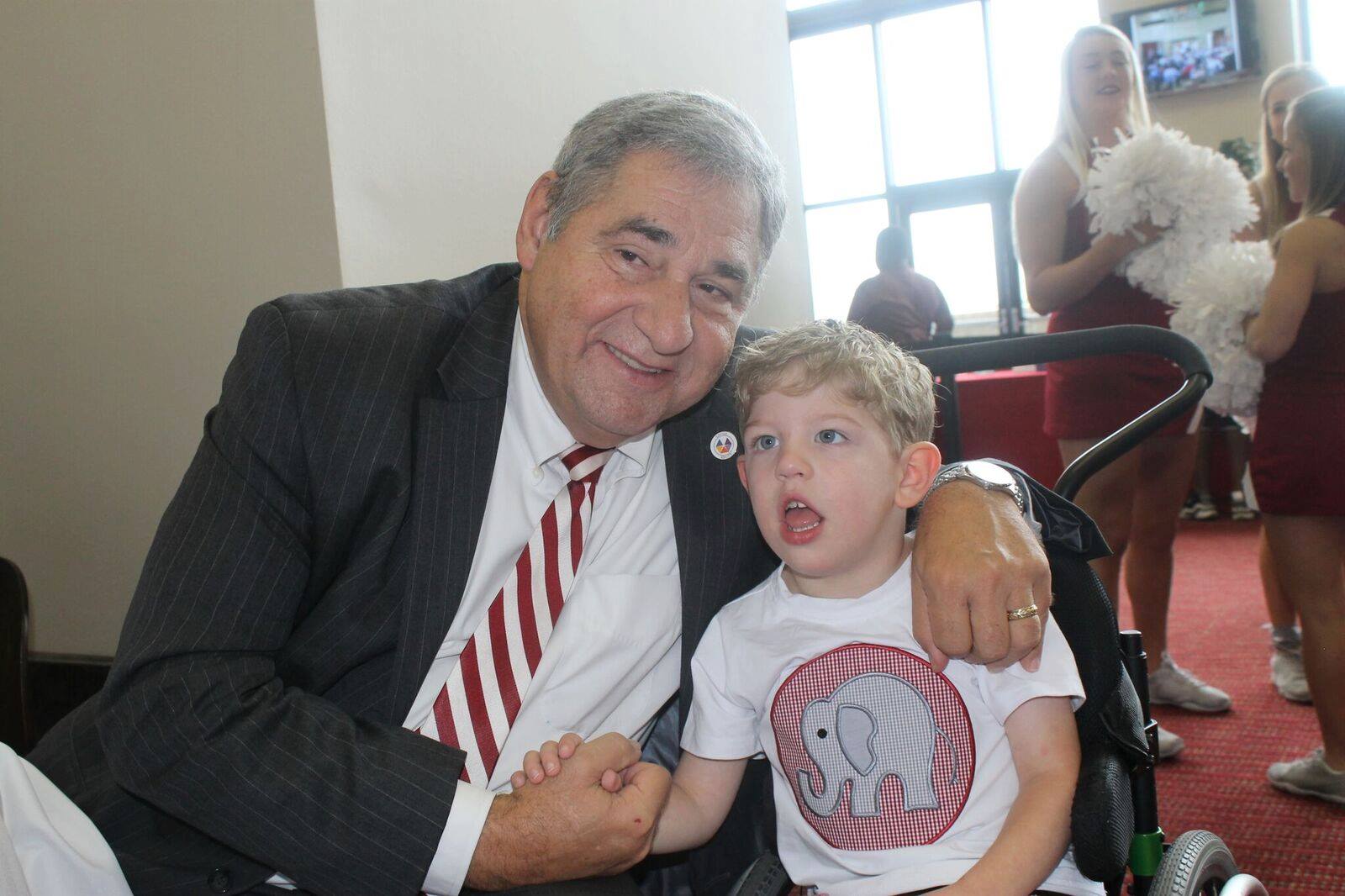 United ability employee and young boy at an Alabama event