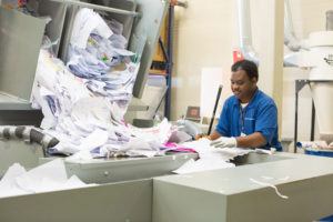 United Ability Gone for Good worker sorting through paper