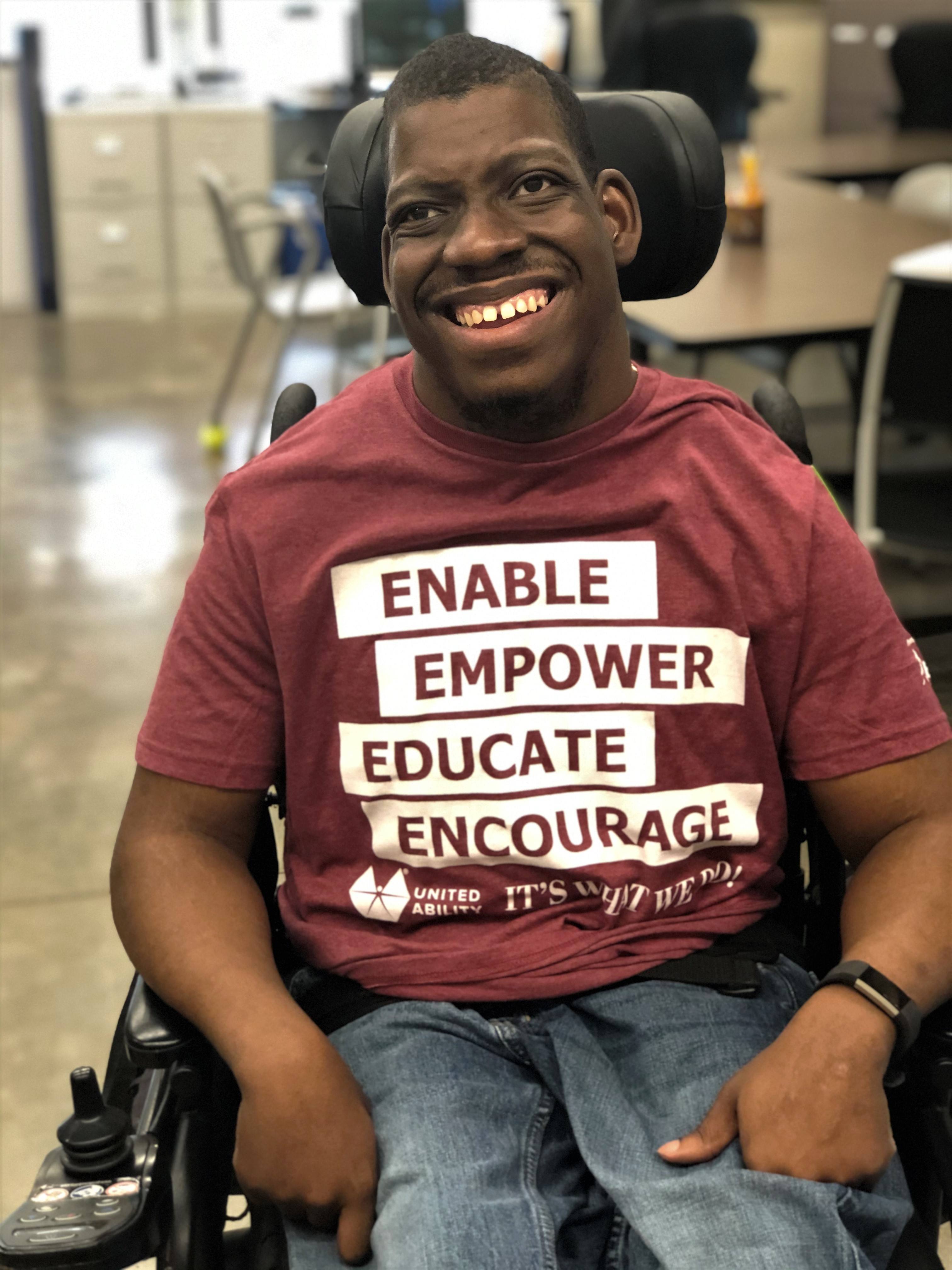 man in wheelchair smiling