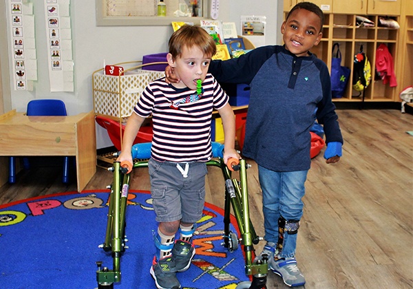 Children in a classroom in Hand In Hand 