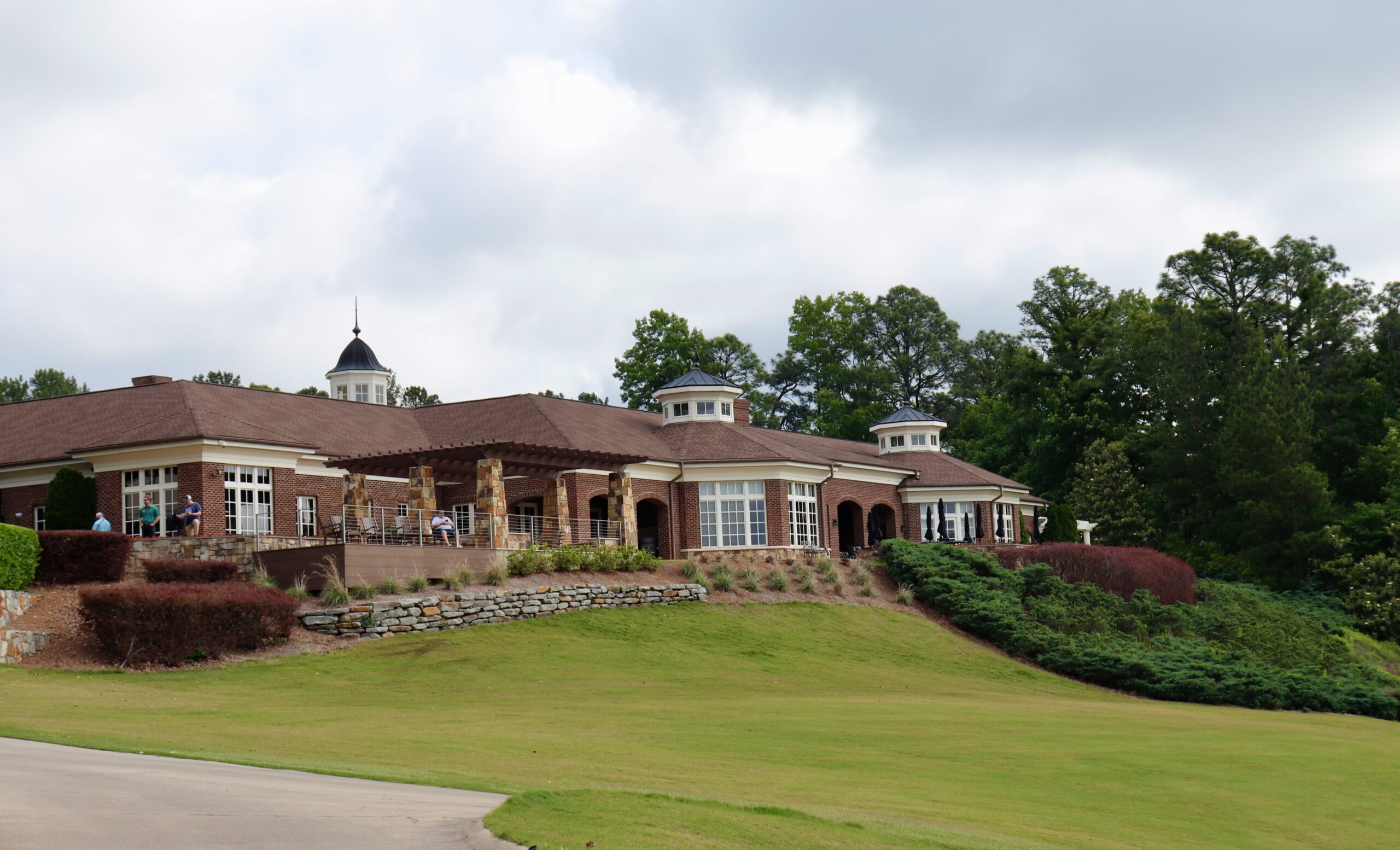 Inverness Country Club clubhouse. A beautiful building on a hill with green grass